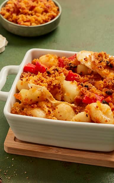 Nhoque gratinado com queijo cabra, coentros, pimento vermelho